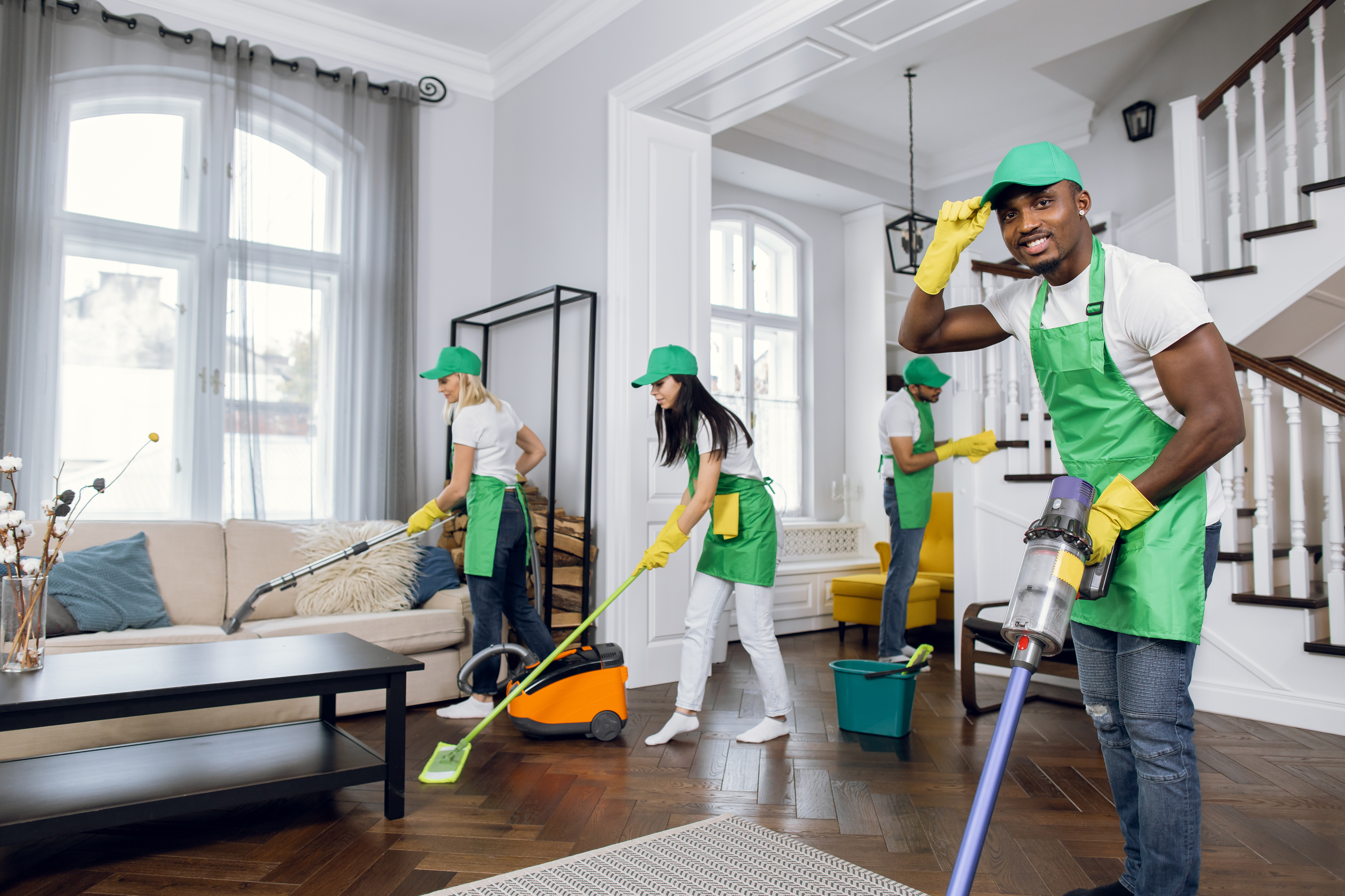 Professional,Mixed,Race,Janitors,In,Uniform,Doing,Spring,Cleaning,Of